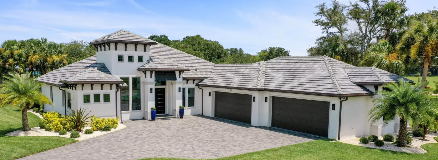 Photograph of custom home with four car garage