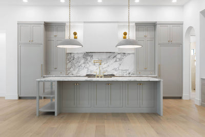Gray kitchen with inset cabinets and large island 