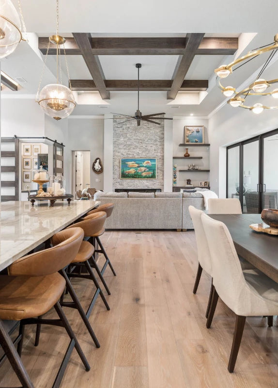 Photo of kitchen island and dining area interior, facing full fireplace